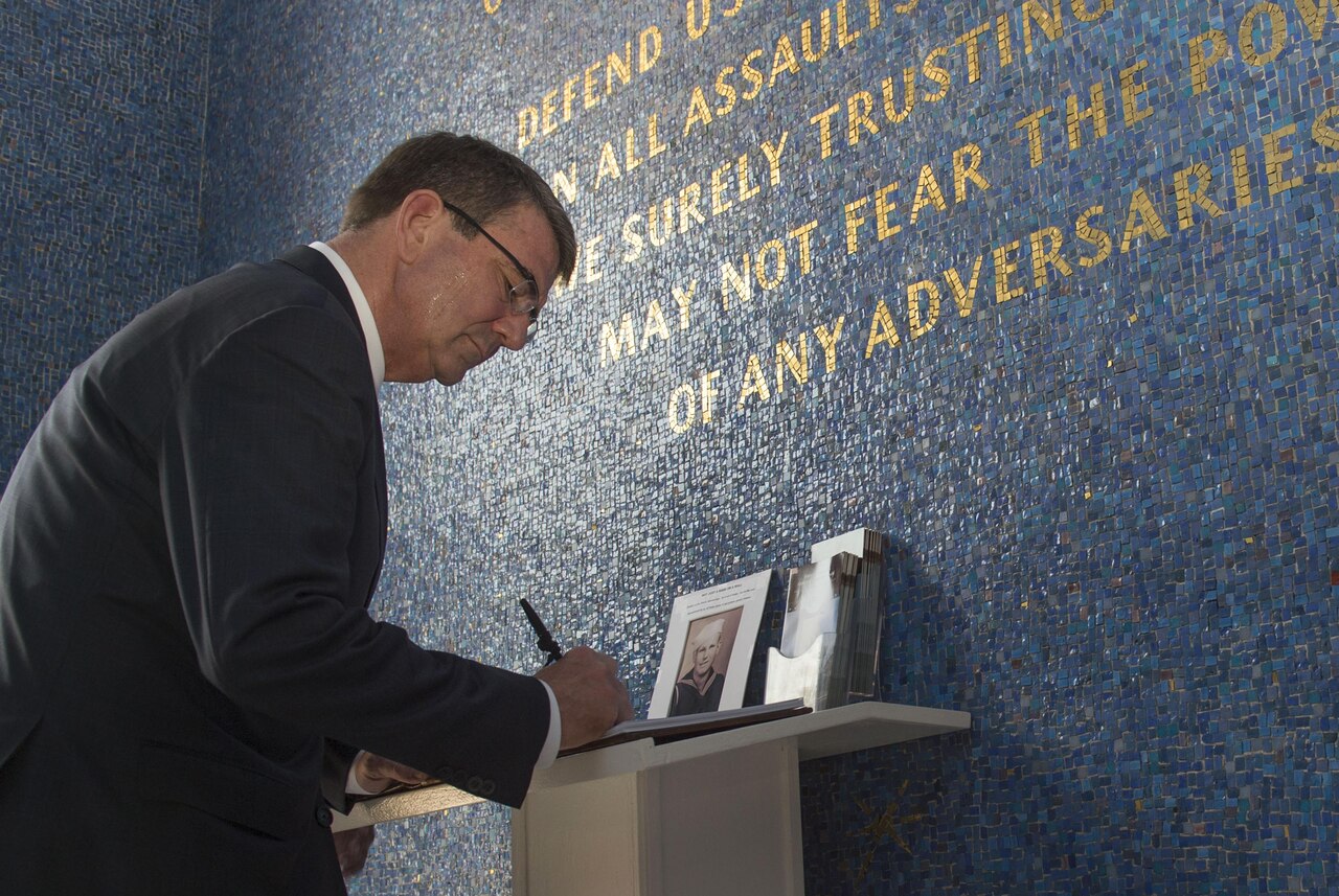 Defense Secretary Ash Carter signs a guest book at the Manila American Cemetery in Manila, Philippines, April 14, 2016, after laying a wreath to honor U.S. service members. DoD photo by Air Force Senior Master Sgt. Adrian Cadiz