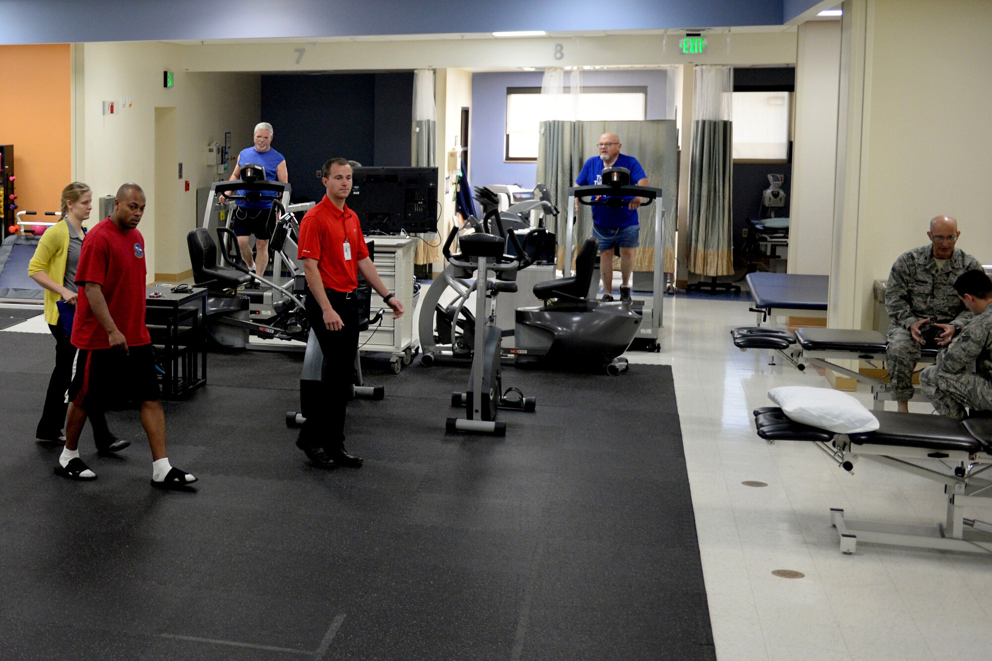 Physical medicine technicians, specialists and interns work with their clients in the physical therapy department April 7, 2016, Keesler Air Force Base, Miss. There are currently 10 interns that perform the bulk of the evaluations and re-evaluations under the supervision of permanent party physical therapists. The physical therapy department treats an average of 160 clients daily. (Air Force Photo by Airman 1st Class Travis Beihl)