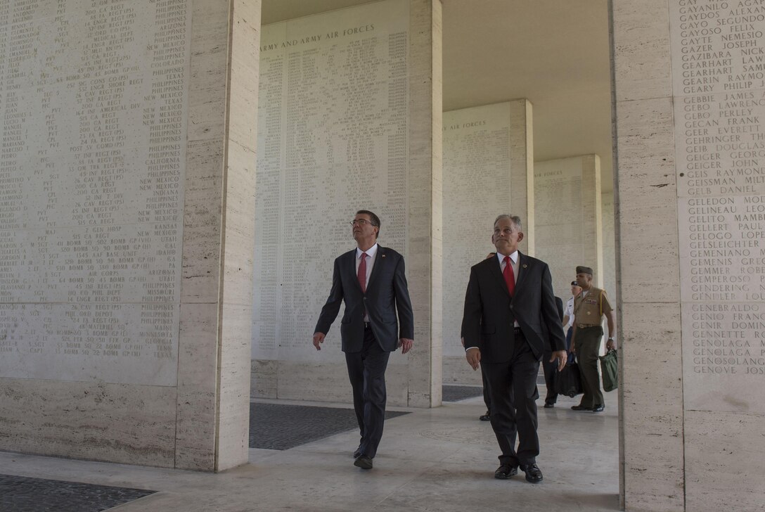 Defense Secretary Ash Carter, left, tours the Manila American Cemetery with a cemetery official in Manila, Philippines, April 14, 2016. DoD photo by Air Force Senior Master Sgt. Adrian Cadiz
