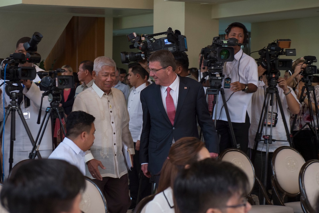 Defense Secretary Ash Carter and Philippine Defense Secretary Voltaire Gazmin arrive to conduct a joint press conference at the Malacanang Palace in Manila, Philippines, April 14, 2016. DoD photo by Air Force Senior Master Sgt. Adrian Cadiz