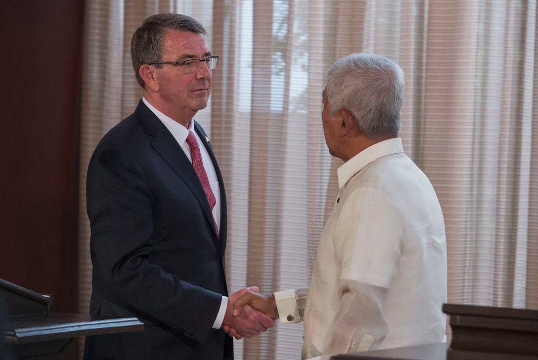 Defense Secretary Ash Carter shakes hands with Philippine Defense Secretary Voltaire Gazmin at the conclusion of a joint press conference at the Malacanang Palace in Manila, Philippines, April 14, 2016. DoD photo by Air Force Senior Master Sgt. Adrian Cadiz