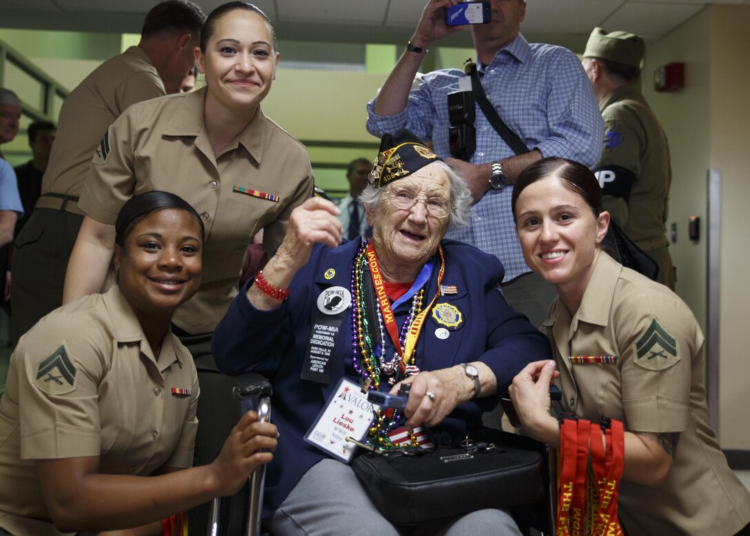 Marines with Marine Forces Reserve greet Lou Lieske, a retired U.S. Army Nurse and World War II veteran at Louis Armstrong New Orleans International Airport, April 13, 2016. Lieske joined other World II veterans as part of Soaring Valor, a program created by the Gary Sinise foundation to provide World War II veterans a special tour of the National World War II Museum and to honor them for their sacrifices. (U.S. Marine Corps photo by Cpl. Ian Leones/ Released)