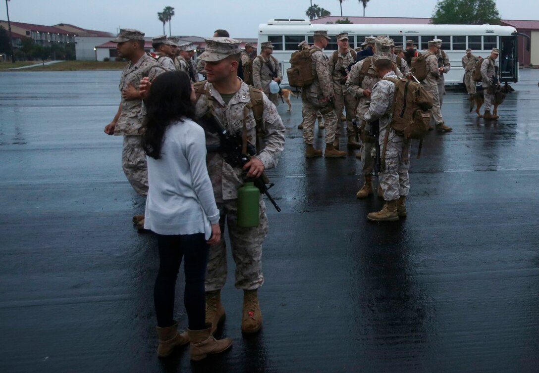 MARINE CORPS BASE CAMP PENDLETON, Calif. – Capt. Nicholas Giordano, an electronic warfare cyber operations planner with the Special Purpose Marine Air-Ground Task Force - Crisis Response - Central Command 16.2, shares a moment with his wife before departing Camp Pendleton April 8, 2016. SPMAGTF-CR-CC is a rotational contingent of approximately 2,300 Marines, sailors and support elements sourced from units throughout I Marine Expeditionary Force. In its fourth iteration, the unit serves as the Marine Corps’ land-based, expeditionary crisis and contingency force in U.S. Central Command. (U.S. Marine Corps photo by Cpl. Angel Serna/Released)