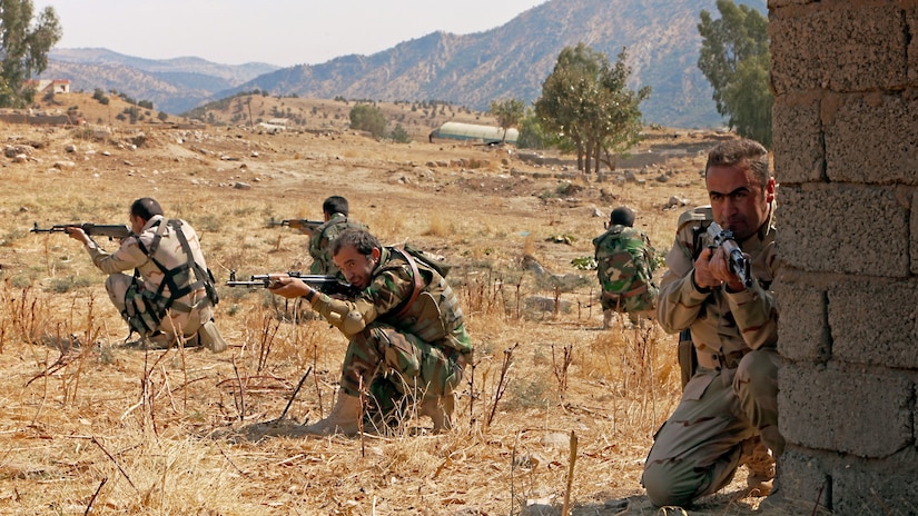 Peshmerga soldiers provide security during react-to-contact training near Irbil, Iraq, Oct. 11, 2015. The coalition runs five training sites in Iraq, where the coalition trains Iraqi and Peshmerga forces. This training is part of Combined Joint Task Force - Operation Inherent Resolve’s mission to build partner capacity and enable the Iraqi security forces to defeat the Islamic State of Iraq and the Levant. Army photo by Spc. Tristan Bolden