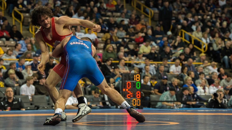 Capt. Bryce Saddoris, captain of the All-Marine Wrestling team, attempts a take down during a match at the 2016 U.S. Olympic Wrestling Trials in Iowa City, Iowa April 9, 2016. Saddoris competed in the 145-pound weight class and was one of four representing the Marine Corps at the event.