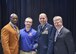 Deryck Toles, founder and executive director of Inspiring Minds (IM), Eric White, 910th Airlift Wing public affairs specialist, Col. James Dignan, 910th Airlift Wing commander, and Ohio State Representative Sean O’Brien pose for a photo at the IM Gala, April 9, 2016. O’Brien presented Dignan and White the Community IMpact Award, recognizing the volunteer efforts of Service members assigned to Youngstown Air Reserve Station, Ohio on behalf of Inspiring Minds. Since beginning in 2006, Inspiring Minds has offered after-school programs to better the lives of under-represented youth in Warren, Ohio. Several YARS Service members regularly volunteer their time to host on-base fitness events, study table and tutoring sessions and fun days for high school students with IM. (Courtesy photo/Bruce Bille, USO of Northern Ohio).