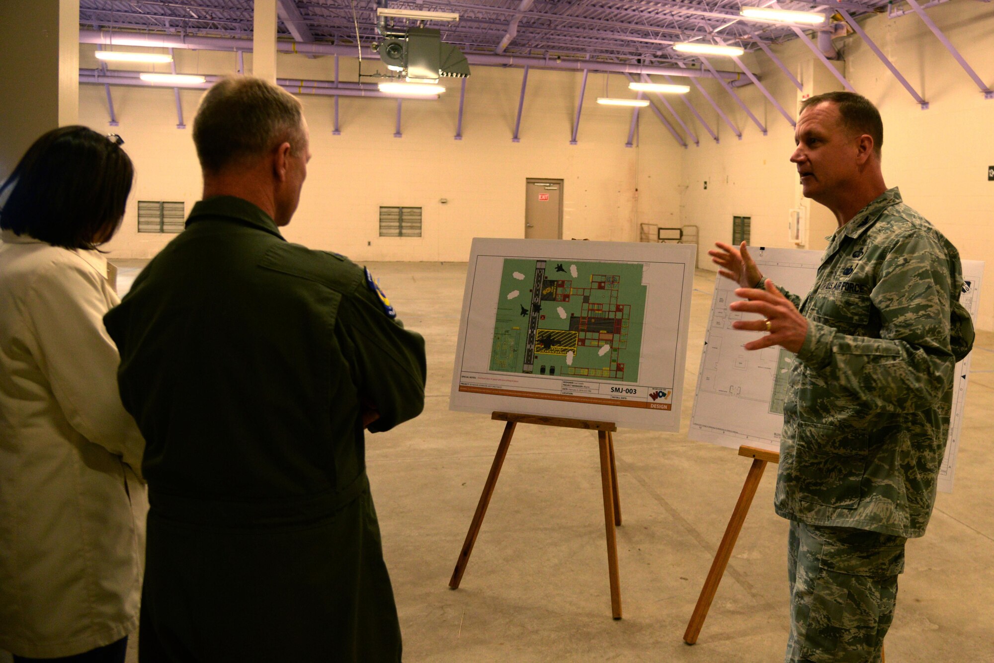 Col. Joe Slavick, 4th Mission Support Group commander, briefs Maj. Gen. Mark Kelly and his wife, Tanya, on plans to build an indoor playground facility at Seymour Johnson Air Force Base, North Carolina, April 8, 2016. The facility is another step in the “Make it Better” initiative to improve quality of life at the base. (U.S. Air Force photo/Staff Sgt. Chuck Broadway)
