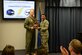 Maj. Gen. Mark Kelly, 9th Air Force commander, presents Staff Sgt. Candace King, 4th Force Support Squadron Airman Leadership School instructor, with the 2015 9th AF Volunteer of the Year award, April 8, 2016, at Seymour Johnson Air Force Base, North Carolina. Kelly visited several squadrons on base to recognize superior performers. (U.S. Air Force photo/Staff Sgt. Chuck Broadway)