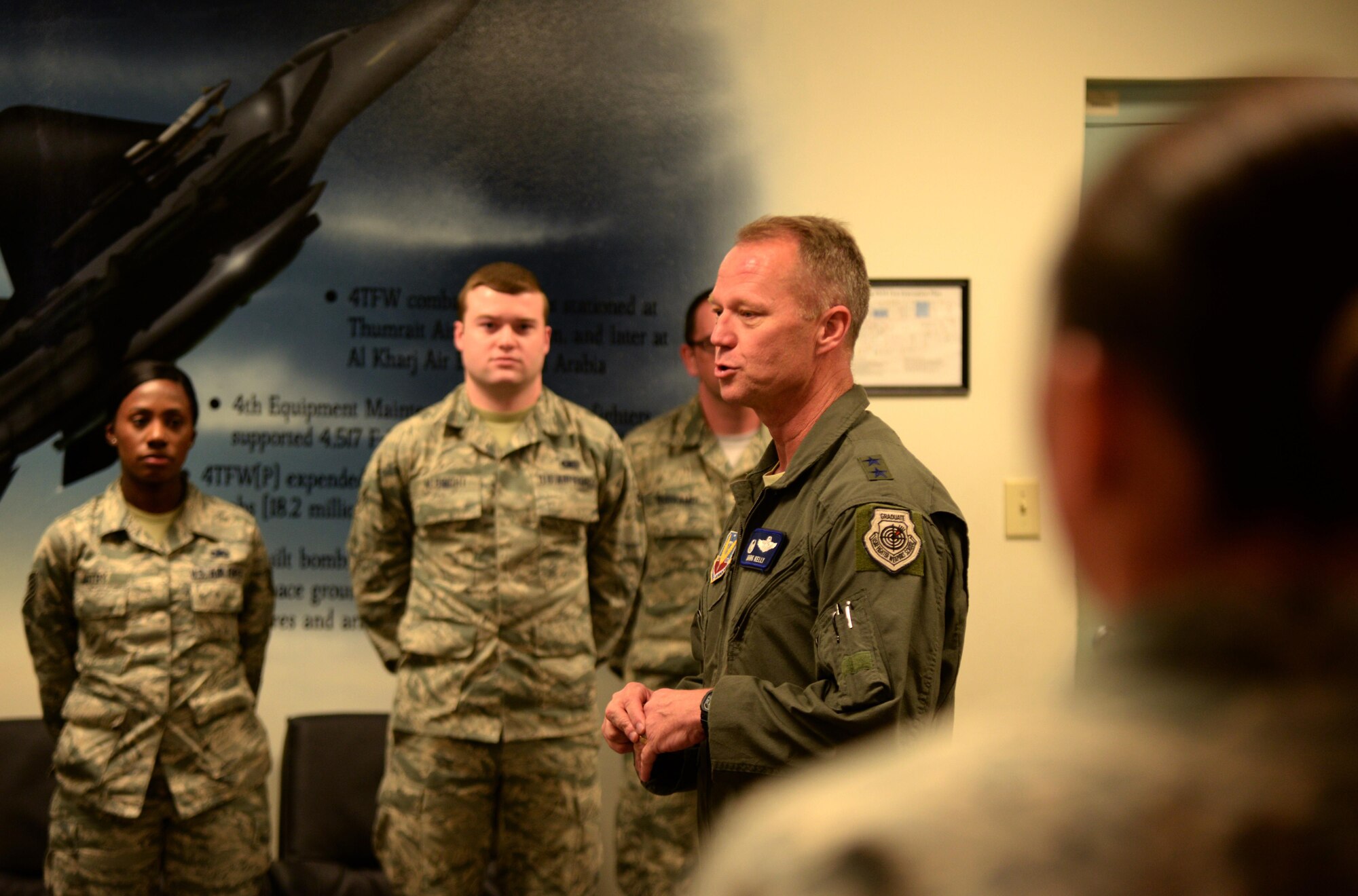 Maj. Gen. Mark Kelly, 9th Air Force commander, speaks to members of the 4th Maintenance Group during a base visit, April 8, 2016, at Seymour Johnson Air Force Base, North Carolina. In addition to meeting Airmen, Kelly also received updates on several projects currently underway at the base. (U.S. Air Force photo/Staff Sgt. Chuck Broadway)