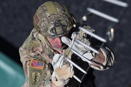 Sgt. 1st Class John Melson, assigned to the Massachusetts Army National Guard’s D Company, 1st Battalion, 182nd Infantry Regiment, ascends the climbing tower at the Warrior Training Center at Fort Benning, Georgia, April 5, 2016, in the run up to compete in the Best Ranger Competition. Melson  is one of eight Soldiers from throughout the Army Guard selected to take part in the upcoming competition, which tests Ranger-qualified Soldiers on a variety of tactical and technical tasks over a physically and mentally demanding course. Competitors from the Army Guard have been training at the WTC for the past several months in preparation for the competition.
