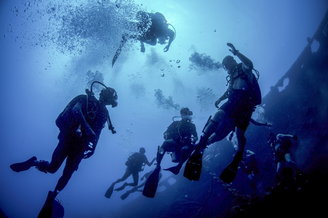 U.S. and Sri Lankan sailors swim near the Tokai Maru, a sunken Japanese freighter from World War II, during a joint diving exercise in  Apra Harbor, Guam, April 13, 2016. Navy photo by Petty Officer 3rd Class Alfred A. Coffield