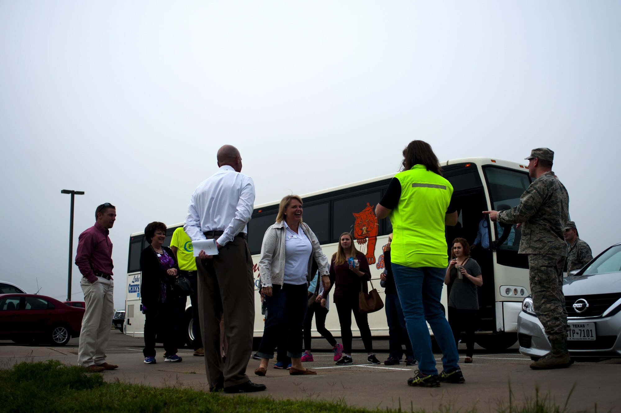 Leadership San Angelo members exits a bus to meet with Joseph J. Gomos, 312th Training Squadron fire protection flight chief, and U.S. Air Force Col. Kurt A. Wendt, 17th Training Group Deputy Commander, for a tour of the Louis F. Garland Department of Defense Fire Academy on Goodfellow Air Force Base, Texas, April 14, 2016. Leadership San Angelo spends an entire day each month touring specific facilities to broaden their leadership skills and learn more about the local community. (U.S. Air Force photo by Senior Airman Scott Jackson/Released)