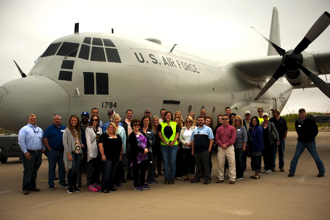 Leadership San Angelo stands in front of a C-35 at the Louis F. Garland Department of Defense Fire Academy during a tour of Goodfellow Air Force Base, Texas, April 14, 2016. Leadership San Angelo spends an entire day each month touring specific facilities in San Angelo to broaden their leadership skills and learn more about the local community. (U.S. Air Force photo by Senior Airman Scott Jackson/Released)