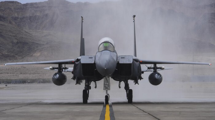 Brig. Gen. Christopher Short, 57th Wing commander, taxis down the runway in an F-16 Fighting Falcon after being sprayed by fire trucks during his fini flight at Nellis Air Force Base, Nev., April 8, 2016. A fini flight is a pilot’s last flight in an aircraft before he/she leaves a squadron, a wing, or retires from the Air Force. (U.S. Air Force photo by Airman 1st Class Kevin Tanenbaum)