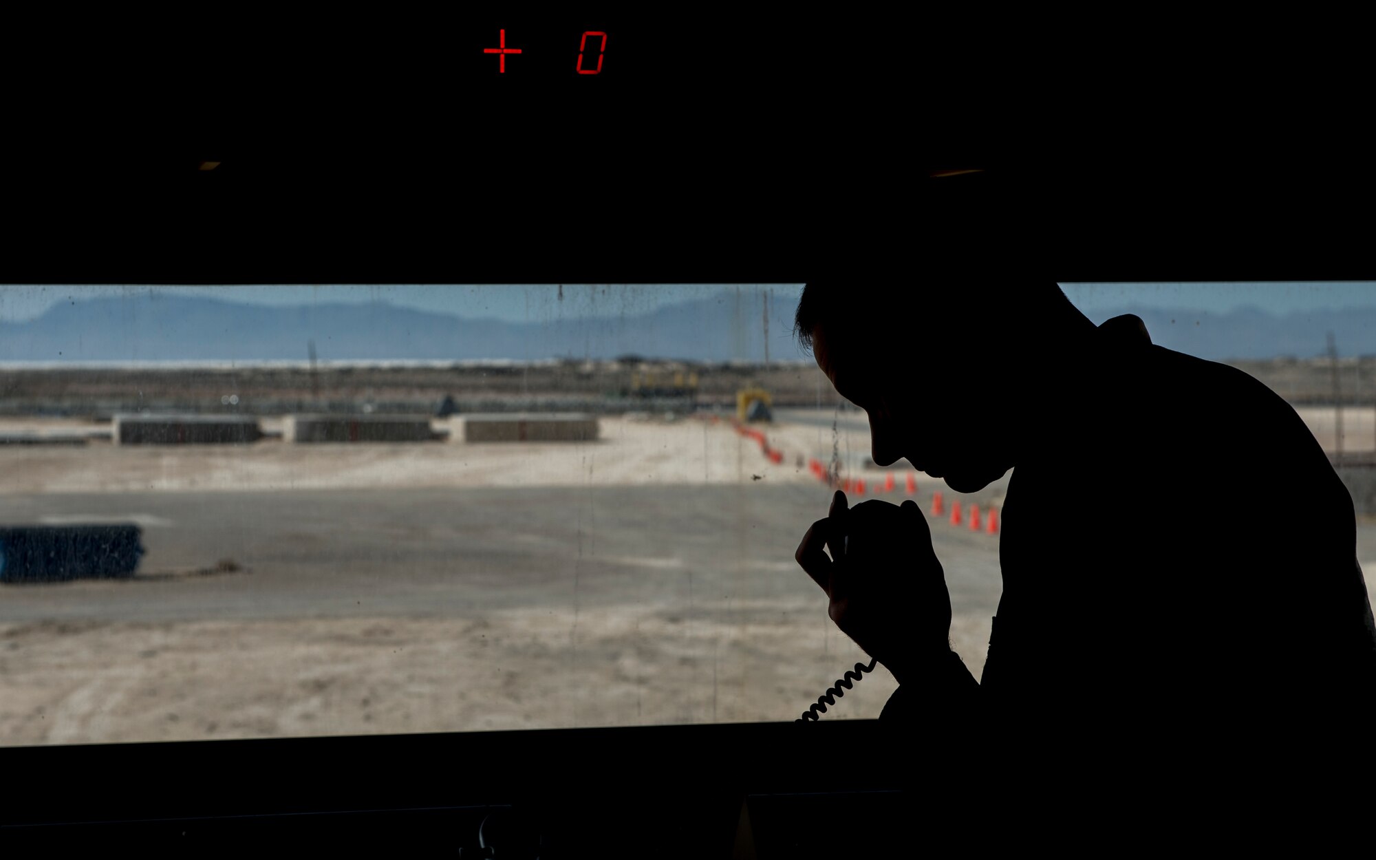 Lt. Col. Shawn Morgenstern, commander of the 846th Test Squadron at Holloman Air Force Base, N.M., relays information via radio after a successful launch here March 4. Teams of engineers, technicians and computer program experts all worked together to break the world record for speed on a magnetically levitated sled system twice in one week. The test sent the sled accelerating at 633 mph – shattering the previous record of 513 mph. (U.S. Air Force photo by Airman 1st Class Randahl J. Jenson)    