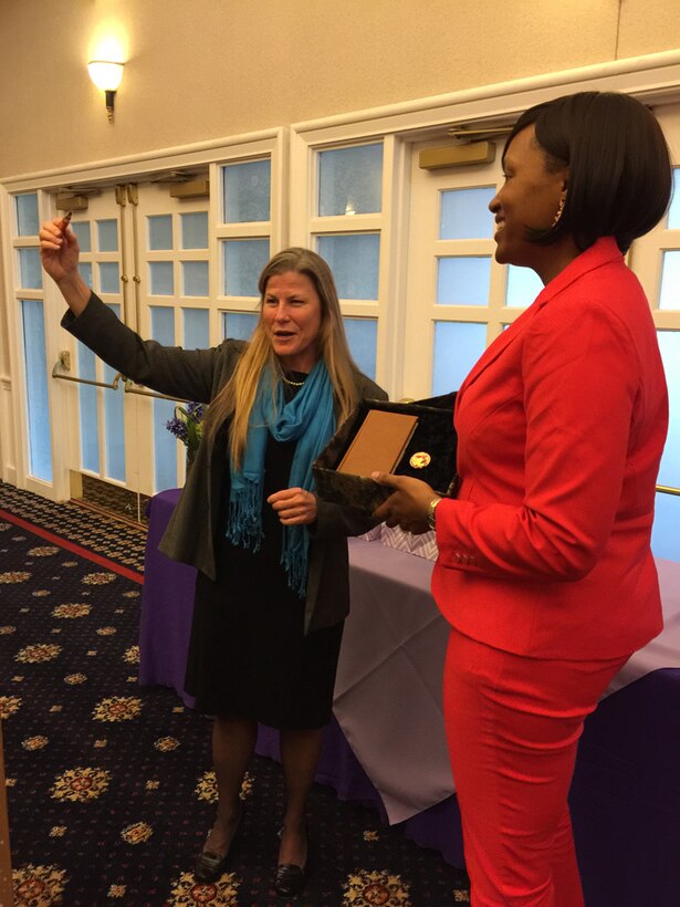 Brig. Gen. Pratt, president of Marine Corps University, receives a gift from Maj. Natasha Everly recently  at the National Naval Officers Association Annual Ladies Luncheon held at The Clubs at Quantico. Pratt was the guest speaker for the event where she talked about empowerment through education. The annual event also serves as a fundraiser for the NOAA scholarship program.