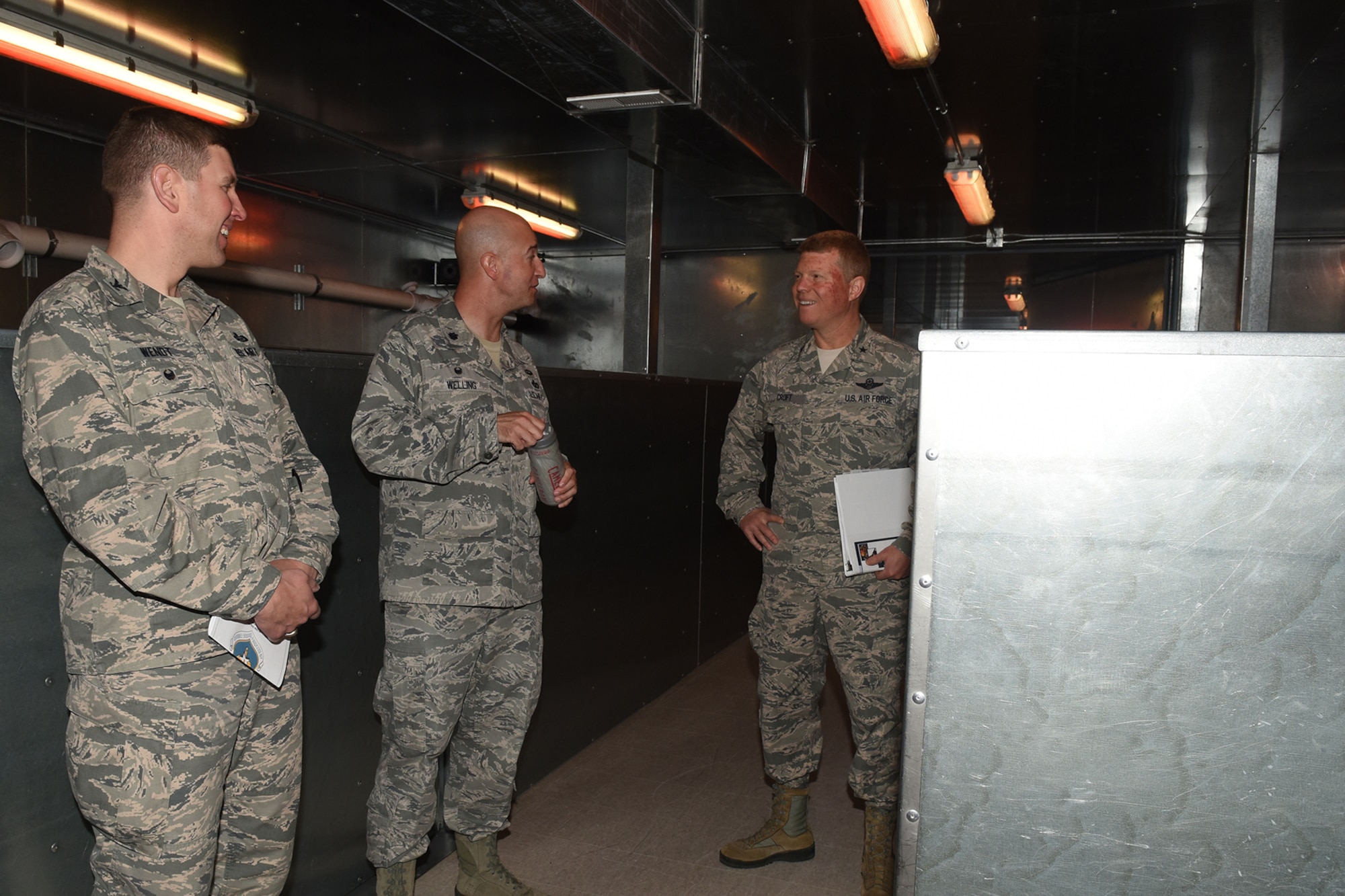 U.S. Air Force Col. Kurt A. Wendt, 17th Training Group Deputy Commander, and Lt. Col. Matthew D. Welling, 312th Training Squadron Commander, show Brig. Gen. Andrew A. Croft, Air Education and Training Command Plans, Programs, Requirements and Assessments Director, the search and rescue trainer at the Louis F. Garland Department of Defense Fire Academy on Goodfellow Air Force Base, Texas, April 12, 2016. The building uses noise and smoke to overstimulate the firefighters’ senses. (U.S. Air Force photo by Staff Sgt. Laura R. McFarlane/Released)