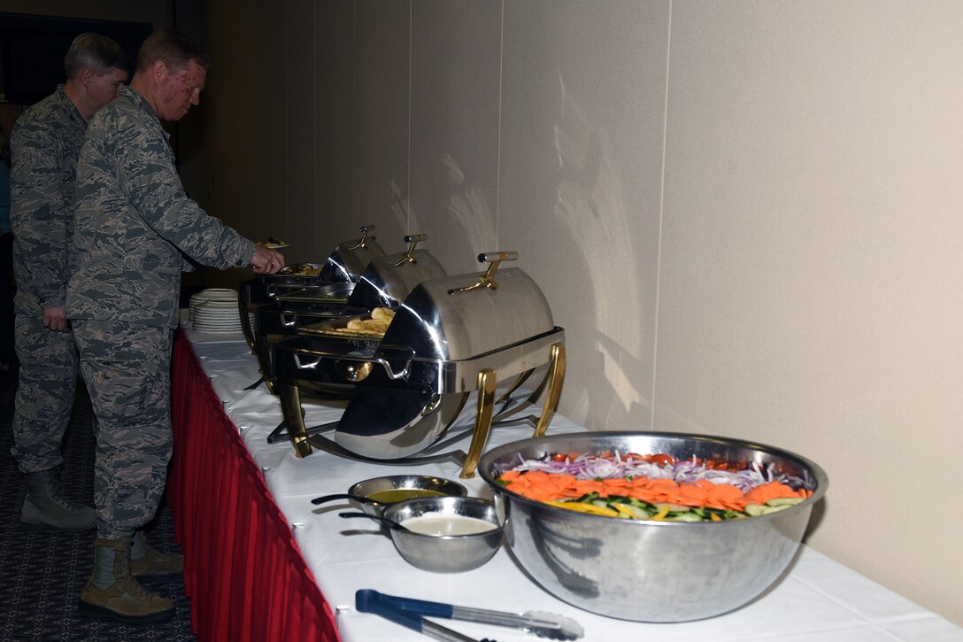 U.S. Air Force Brig. Gen. Andrew A. Croft, Air Education and Training Command Plans, Programs, Requirements and Assessments Director, and Col. Terry J. Hamrick Jr., 17th Training Wing Vice Commander, go through the buffet line provided by the new café at the Event Center on Goodfellow Air Force Base, Texas, April 12, 2016. Croft toured the base on April 11 and 12. (U.S. Air Force photo by Staff Sgt. Laura R. McFarlane/Released)