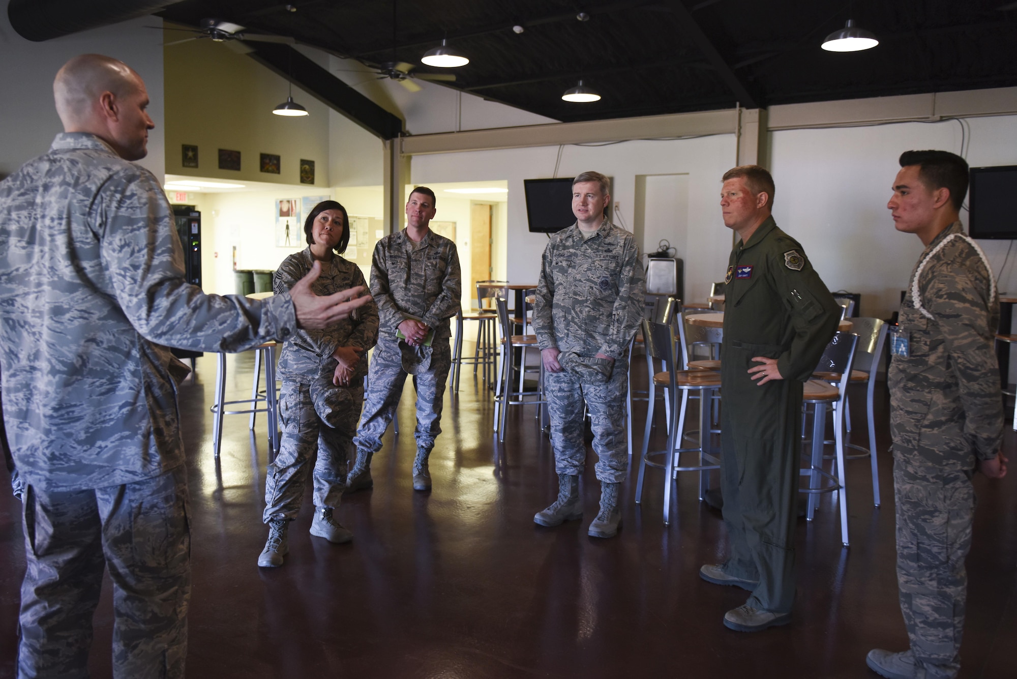 U.S. Air Force Chaplain (Maj.) Craig M. Forsythe, 17th Training Wing chaplain, briefs Brig. Gen. Andrew A. Croft, Air Education and Training Command Plans, Programs, Requirements and Assessments Director (flight suit), on the activities Crossroads offers to students on Goodfellow Air Force Base, Texas, April 11, 2016.  Crossroads offers a kitchen, movie room, music room and more. Chief Master Sgt. JoAnne S. Bass, 17th TRW Command Chief; Col. Kurt A. Wendt, 17th Training Group Deputy Commander; and Col. Terry J. Hamrick Jr., 17th TRW Vice Commander, joined Croft on his tour of the base. (U.S. Air Force photo by Airman Chase Sousa/Released)