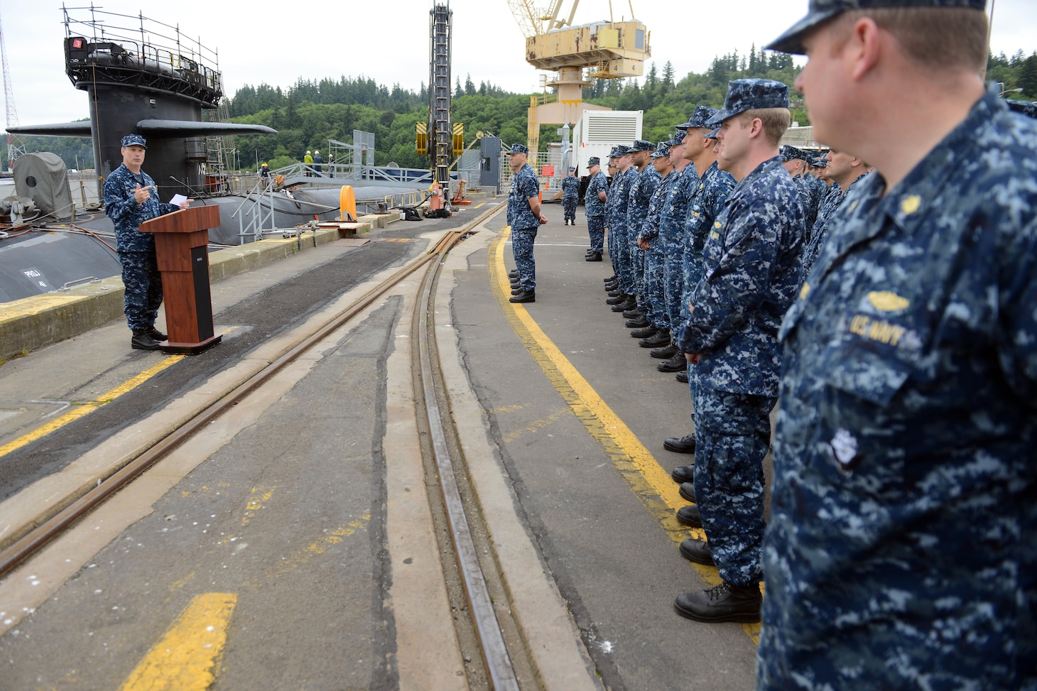 BANGOR, Wash. (June 18, 2014) Rear Adm. Dietrich Kuhlmann, commander of Submarine Group (SUBGRU) 9, speaks to the Blue and Gold crews of the ballistic missile submarine USS Pennsylvania (SSBN 735) during a Meritorious Unit Commendation presentation at Naval Base Kitsap-Bangor. Pennsylvania earned the award for completing the most successful return to service to date for an Ohio-class submarine following a refueling overhaul. (U.S. Navy photo by Chief Mass Communication Specialist Ahron Arendes/Released)