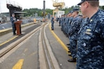BANGOR, Wash. (June 18, 2014) Rear Adm. Dietrich Kuhlmann, commander of Submarine Group (SUBGRU) 9, speaks to the Blue and Gold crews of the ballistic missile submarine USS Pennsylvania (SSBN 735) during a Meritorious Unit Commendation presentation at Naval Base Kitsap-Bangor. Pennsylvania earned the award for completing the most successful return to service to date for an Ohio-class submarine following a refueling overhaul. (U.S. Navy photo by Chief Mass Communication Specialist Ahron Arendes/Released)