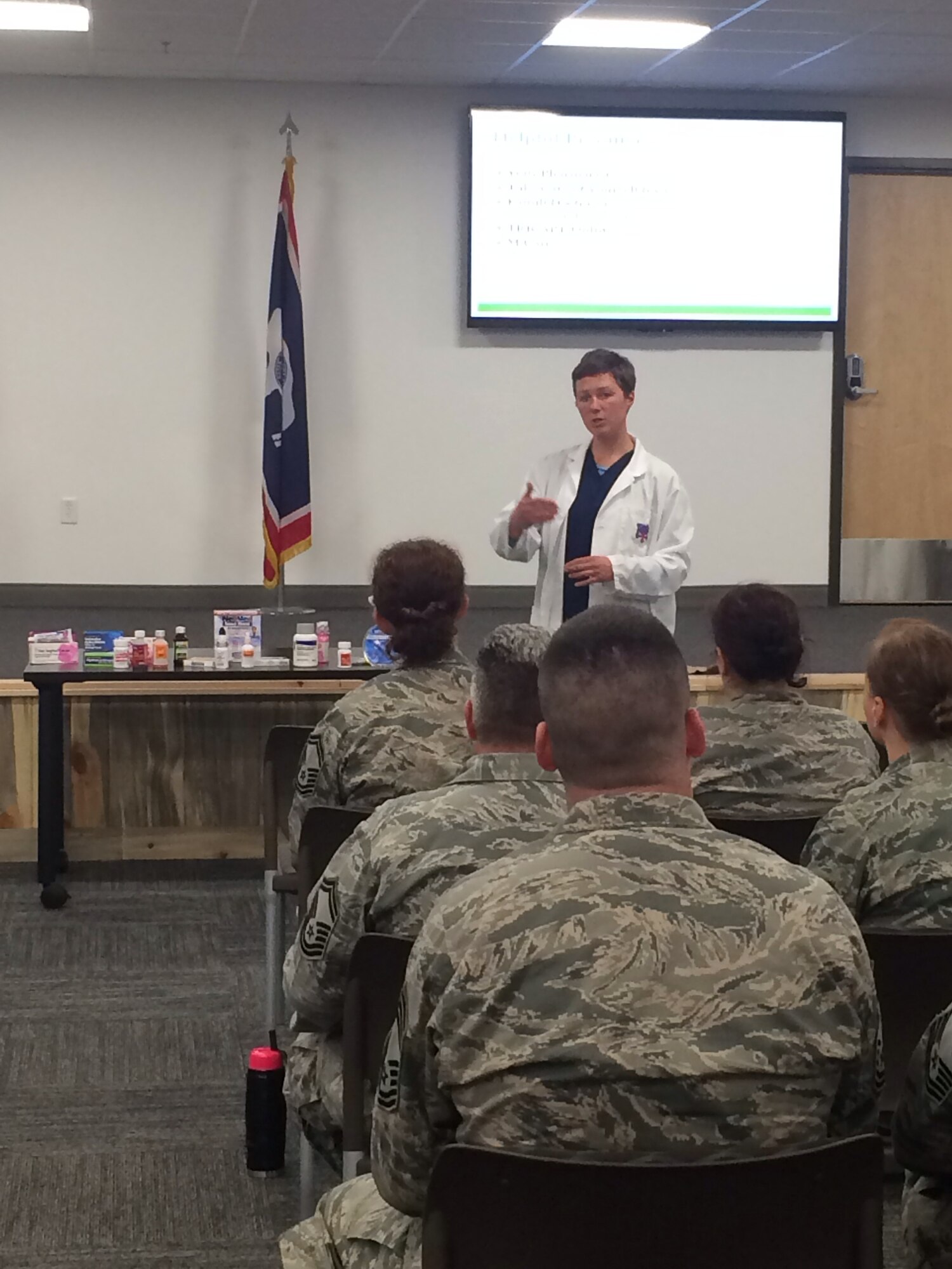 Dr. Natasha Hughes, 90th Medical Support Squadron pharmacist, conducts a Self-Initiated Care Kit Program brief April 6, 2016, for Airmen at the Wyoming Air National Guard base in Cheyenne. The program lets clients of the 90th Medical Group’s clinic on F.E. Warren Air Force Base get over-the-counter cold medicine at no cost and without having to make an appointment with their healthcare provider. (Courtesy photo)