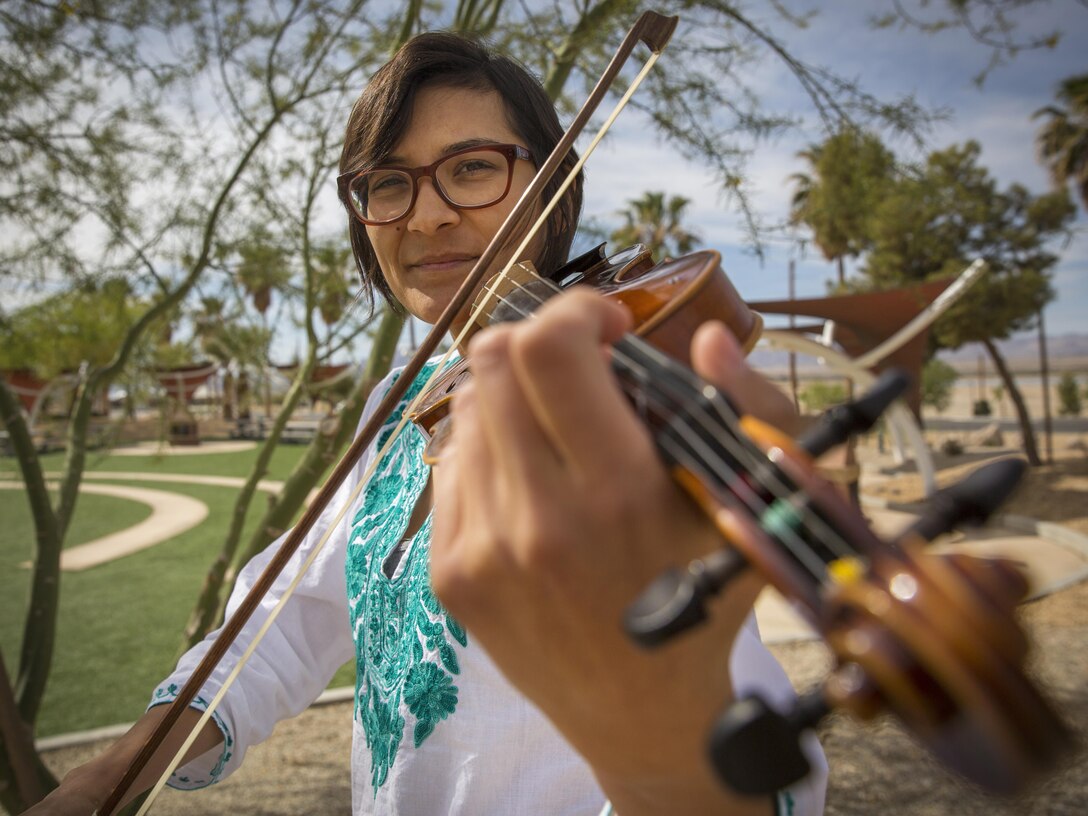 Cpl. Ashley Arvis, expeditionary airfield support specialist, Marine Wing Support Squadron 374, plays violin for Joshua Tree Philharmonic Orchestra at the High Desert Cultural Center in Joshua Tree, Calif. She has been playing the violin since she was seven years old. (Official Marine Corps photo by Lance Cpl. Levi Schultz/Released)