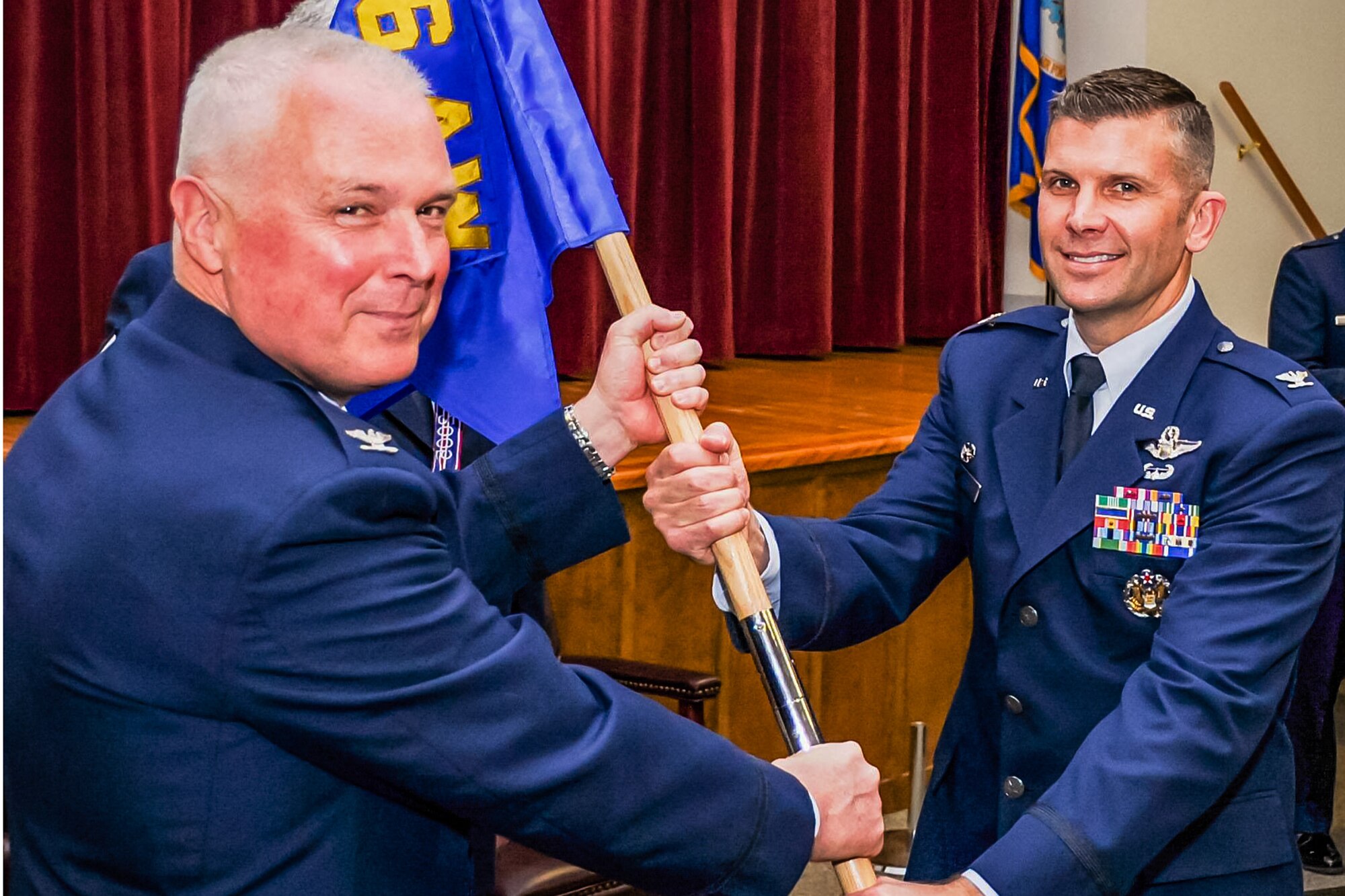Col. Sean Pierce (right), assumes command of the 446th Operations Group here, from Col. Scott McLaughlin, 446th Airlift Wing commander, during a change of command ceremony here, April 2, 2016. (U.S. Air Force Reserve photo by Staff Sgt. Daniel Liddicoet)