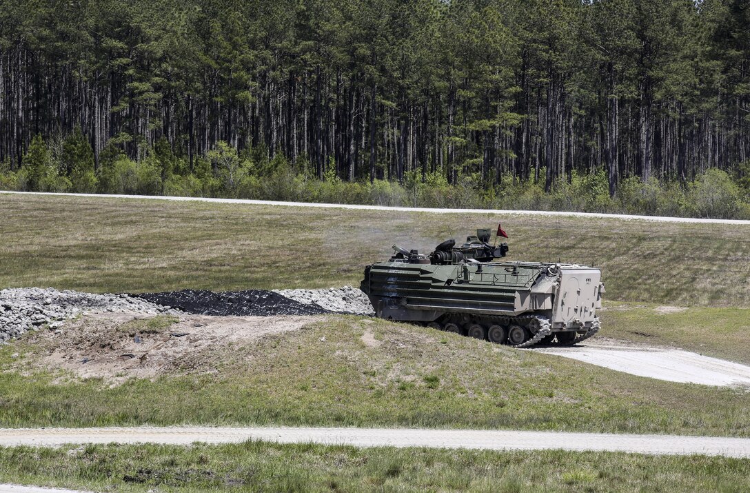 Marines with Alpha Company, 2nd Assault Amphibian Battalion fire on targets with their amphibious assault vehicles during a gunnery skills exercise at Camp Lejeune, N.C., April 13, 2016. Marines utilized the AAV’s .50 caliber machine gun and Mk-19 40mm grenade launcher to engage targets at distances between 400 and 2000 meters. (U.S. Marine Corps photo by Cpl. Paul S. Martinez/Released)