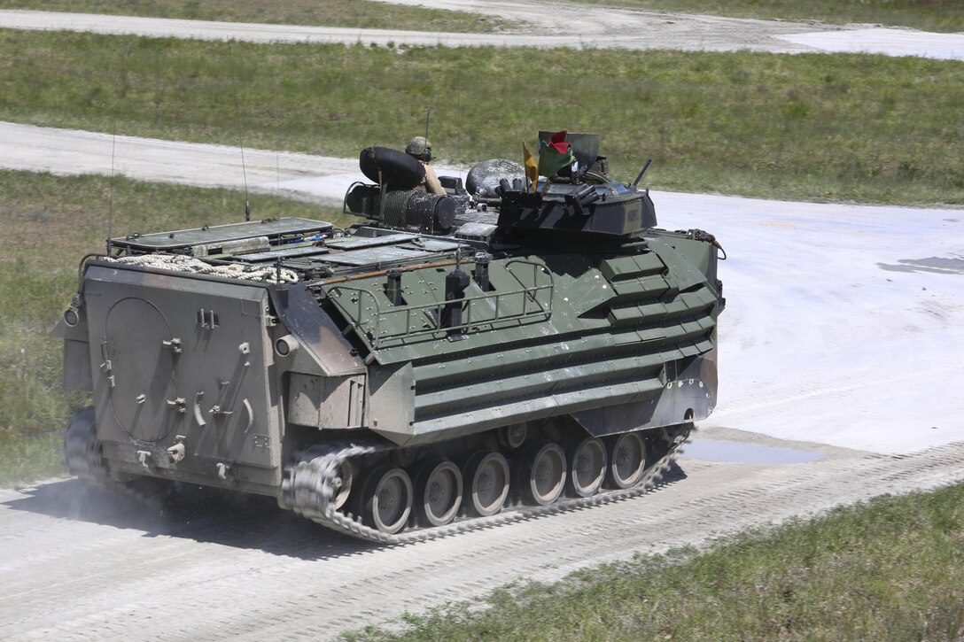 Marines with Alpha Company, 2nd Assault Amphibian Battalion maneuver downrange in an amphibious assault vehicle during a gunnery skills exercise at Camp Lejeune, N.C., April 13, 2016. The company conducted the training to prepare for their upcoming participation in the Integrated Training Exercise. (U.S. Marine Corps photo by Cpl. Paul S. Martinez/Released)