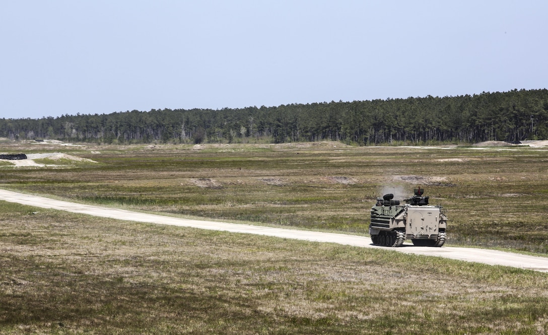 Marines with Alpha Company, 2nd Assault Amphibian Battalion fire on targets with their amphibious assault vehicle during a gunnery skills exercise at Camp Lejeune, N.C., April 13, 2016. Marines utilized the AAV’s .50 caliber machine gun and Mk-19 40mm grenade launcher to engage targets at distances between 400 and 2000 meters. (U.S. Marine Corps photo by Cpl. Paul S. Martinez/Released)