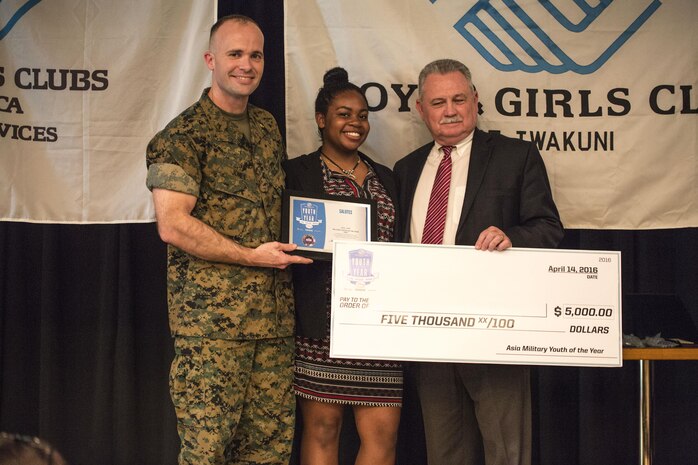 Maya Pugh, a teen from Yokosuka Naval Base, receives the 2016 Asia Military Youth of the Year Award  during the 2016 Asia Keystone Conference at Marine Corps Air Station Iwakuni, Japan, April 13, 2016. Teens from across the pacific region gathered to find out the winner of the 2016 Asia Military Youth of the Year Award. (U.S. Marine Corps photo by Cpl. Nathan Wicks/Released)