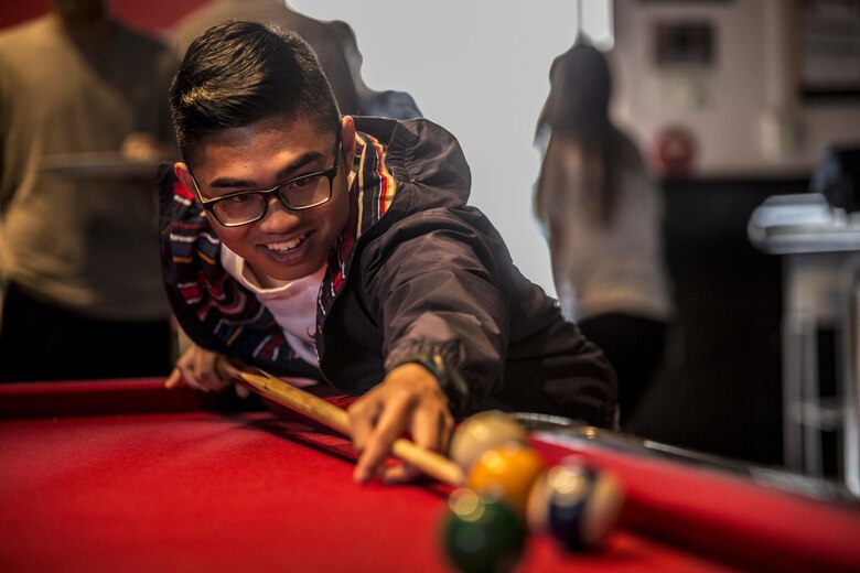 Ryan JayVisico, a teenager from Yokota Air Base, plays pool during the 2016 Asia Keystone Conference at Marine Corps Air Station Iwakuni, Japan, April 13, 2016. The Keystone Club and Boys and Girls Club of Iwakuni hosted this event to bring teens from different parts of the world together and name 2016’s Asia State Military Youth of the Year. (U.S. Marine Corps photo by Cpl. Nathan Wicks/Released)