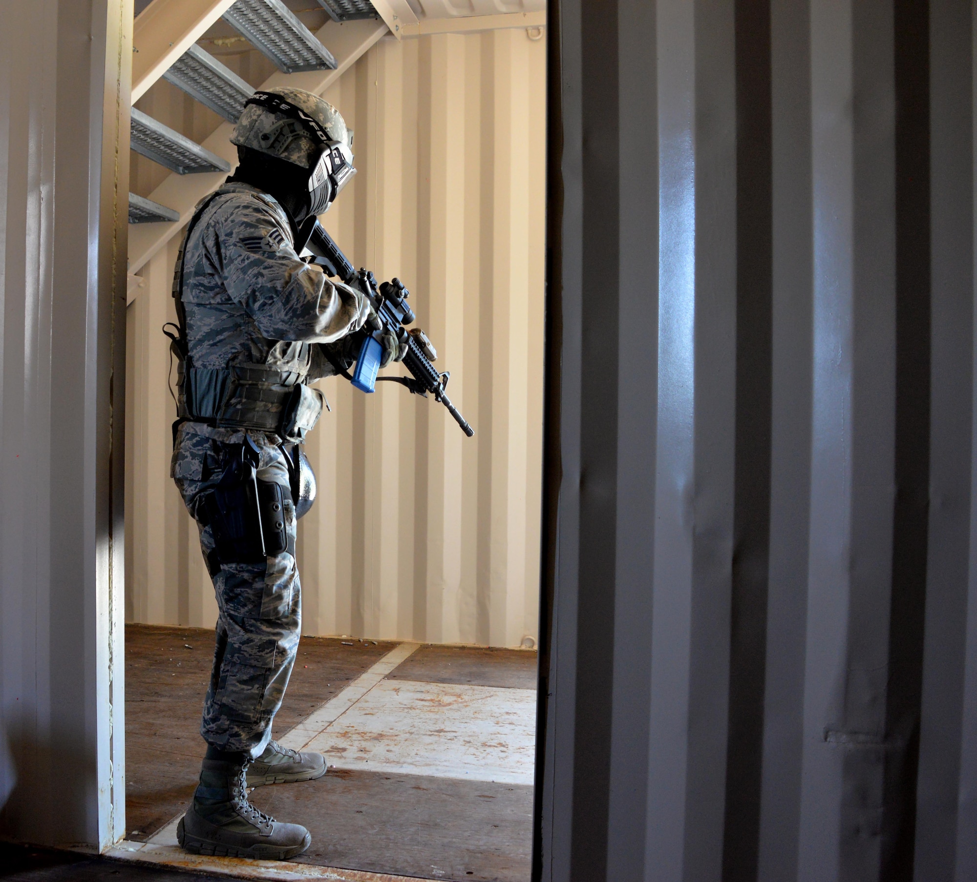 A senior airman assigned to the 60th Security Forces Squadron works to clear a building during an active shooter training event April 13, 2016, at Travis Air Force Base, California. The active shooter training took place at the installation’s newly constructed Emergency Responder Urban Training Site. (U.S. Air Force photo by Staff Sgt. Charles Rivezzo)