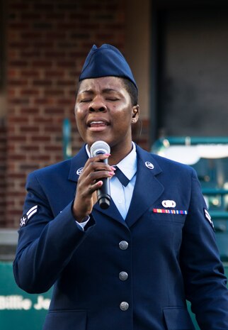 Airman 1st Class Kahdija Slaughter, a public affairs broadcast journalist, sings the national anthem during the opening ceremonies at the Volvo Car Open Tennis Tournament on Military Appreciation Night April 7, 2016, at the Family Circle Cup Stadium on Daniel Island S.C. On average, Slaughter sings the national anthem twice a month for military and non-military events.