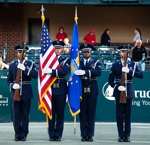 Joint Base Charleston Honor Guard present the colors for the opening ceremonies at the Volvo Car Open Tennis Tournament on Military Appreciation Night April 7, 2016, at the Family Circle Cup Stadium on Daniel Island S.C. Military Appreciation Night included the presentation of the colors, the signing of the national anthem and a coin toss done by military members.