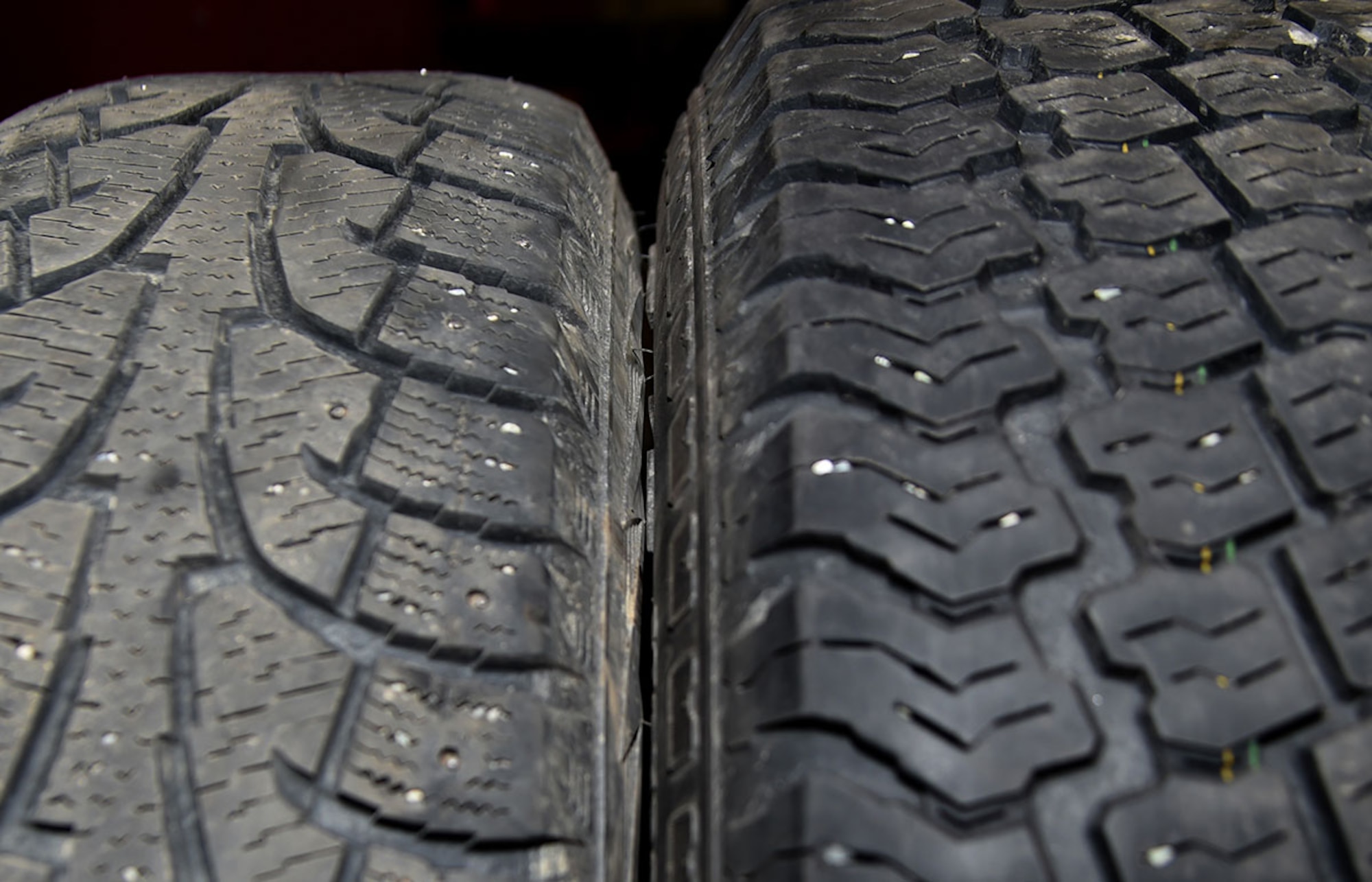 A set of winter tires are dismounted while a set of summer tires are mounted on rims at the Auto Skills Center, Joint Base Elmendorf-Richardson, Alaska, April 14, 2016. According to the Division of Motor Vehicles, it is unlawful to operate a motor vehicle with studded tires on a paved highway or road from May 1 through September 15. (U.S. Air Force photo by Staff Sgt. Sheila deVera)