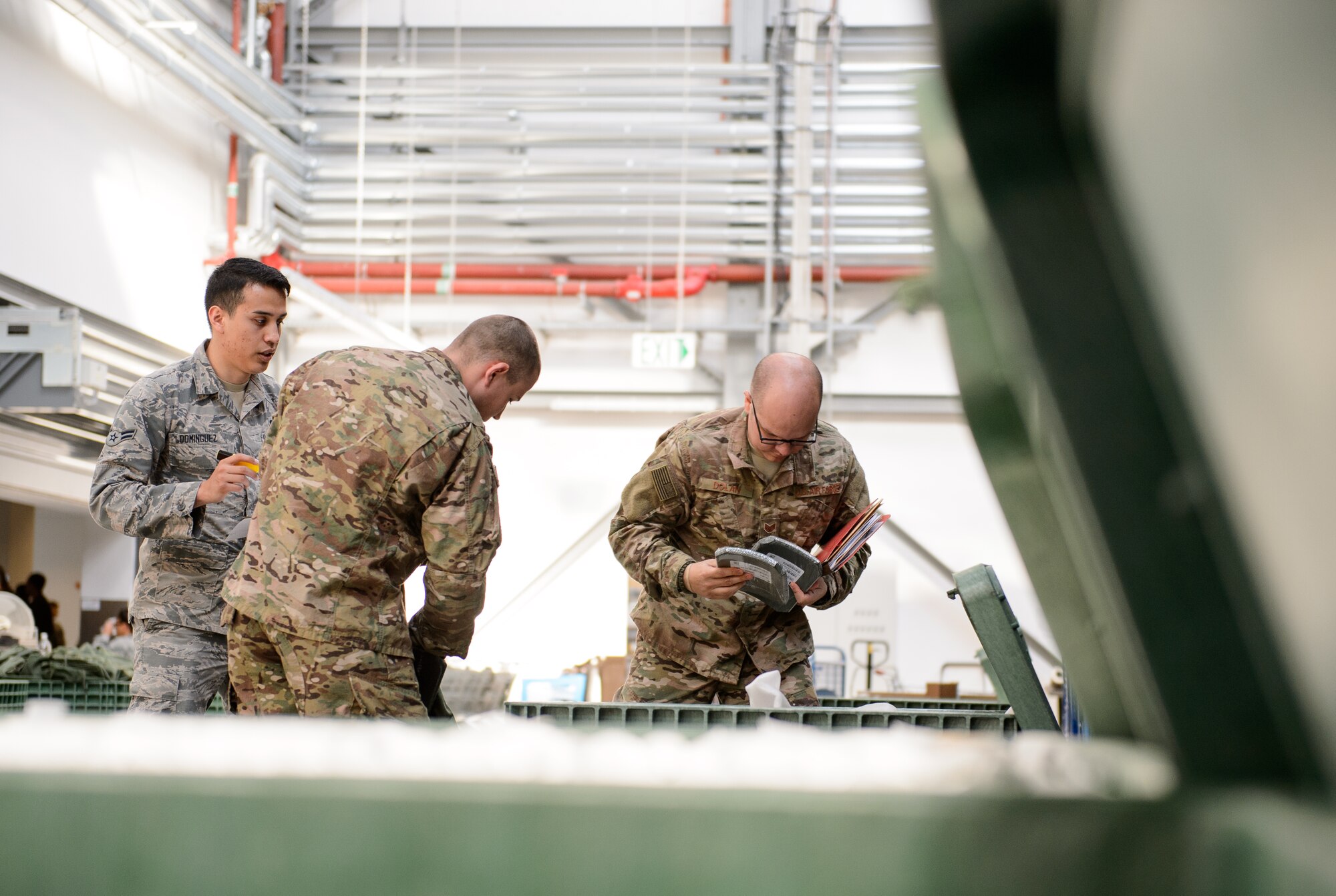 Airmen from the 435th Air Ground Operations Wing receive equipment for their upcoming deployment at Ramstein Air Base, Germany, April 11, 2016. Airmen from the 435th AGOW must be ready to deploy and perform their mission at a moment’s notice, during the week the Airmen gathered necessary equipment, training and documents for a future deployment. (U.S. Air Force photo/Staff Sgt. Armando A. Schwier-Morales)