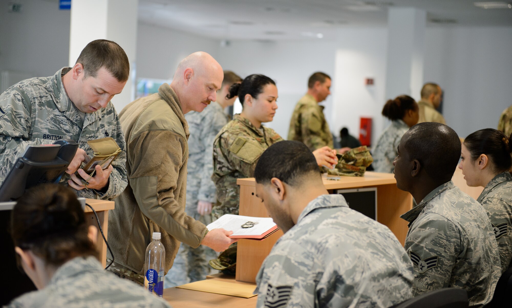 Airmen from the 435th Contingency Response Group ensure their documents are ready in preparation for a deployment April 11, 2016, at Ramstein Air Base, Germany. Airmen are required to be ready to deploy at any time to their mission. (U.S. Air Force photo/Staff Sgt. Armando A. Schwier-Morales) 