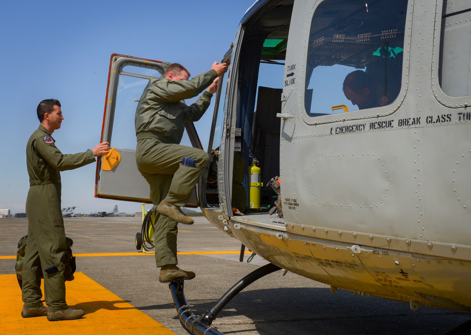 Lt. Gen. John Dolan, U.S. Forces, Japan and 5th Air Force commander, exits a 459th Airlift Squadron UH-1N Iroquois at Yokota Air Base, Japan, April 11, 2016. Dolan, who is an F-16 Fighting Falcon pilot, flew a UH-1N for the first time with assistance from 459th Airlift Squadron crew members in order to better understand 459 AS capabilities. (U.S. Air Force photo by Airman 1st Class Elizabeth Baker/Released)