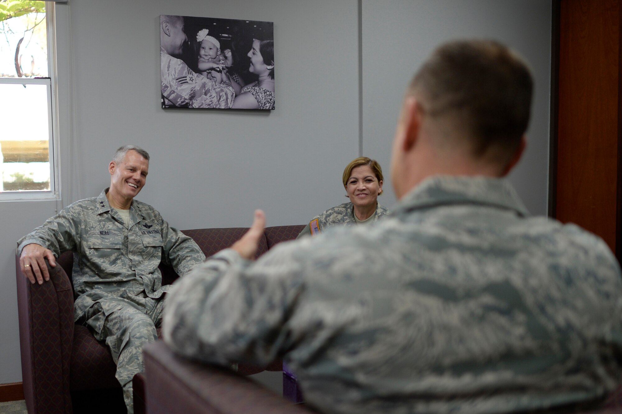 U.S. Air Force Acting Director, Air National Guard, Maj. Gen. Brian G. Neal, left, is welcomed by 156th Airlift Wing Commander, Lt. Col. Edward L. Vaughan, center, and the Adjutant General of the Puerto Rico National Guard, Maj. Gen. Marta Carcana during his April 9 visit to the 156th AW, Muñiz Air National Guard Base, Carolina, Puerto Rico. Neal attended briefings and toured facilities at the 156th AW and the 141st Air Control Squadron, Punta Borinquen Radar Site, Aguadilla, Puerto Rico. (U.S. Air  National Guard photo by Staff Sgt. Christian Jadot)