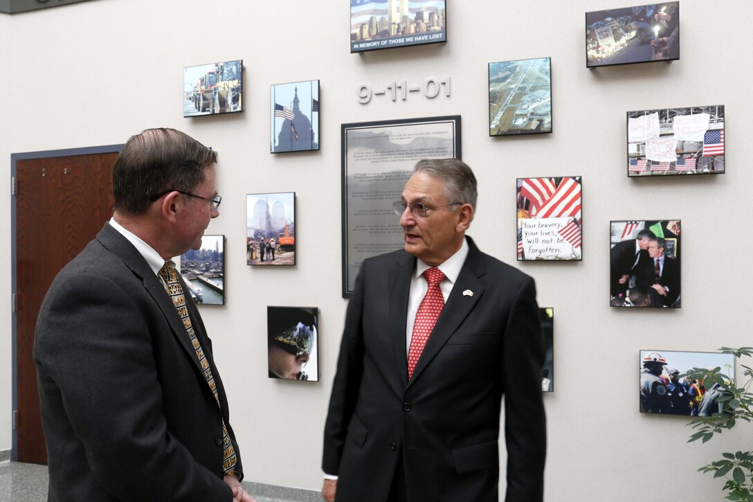 Mr. Luis Felipe Puente (right), Mexico's National Coordinator for Civil Protection, visited the 9-11 Memorial at NORAD and USNORTHCOM with Mr.
Randel Zeller (left), Director of NORAD and USNORTHCOM Interagency Directorate, during his visit April 13, 2016. Mr. Puente's visit was an exchange of information on disaster response and preparation. 
