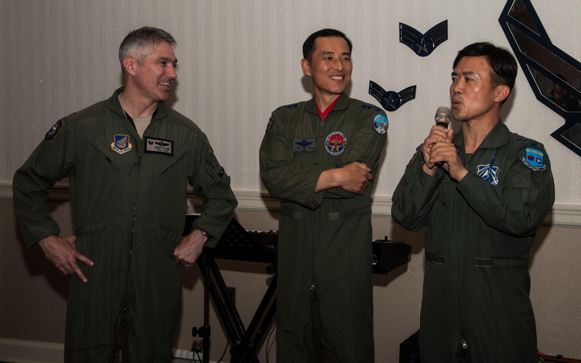 Col. Jeremy Sloane, 8th Fighter Wing commander, Col. Seong-Bok Lee, 38th Fighter Group commander, Col. Bang Jung Ryul, Korean Air Force Operation Command A8 and A9 chief, speak during a Max Thunder Ice Breaker April 15, 2016 The Ice Breaker was held to welcome incoming follow-on forces as part of Max Thunder, which is a regularly scheduled training exercise designed to enhance the readiness of U.S. and ROK forces to defend the Republic of Korea. (U.S. Air Force photo by Staff Sgt. Nick Wilson)