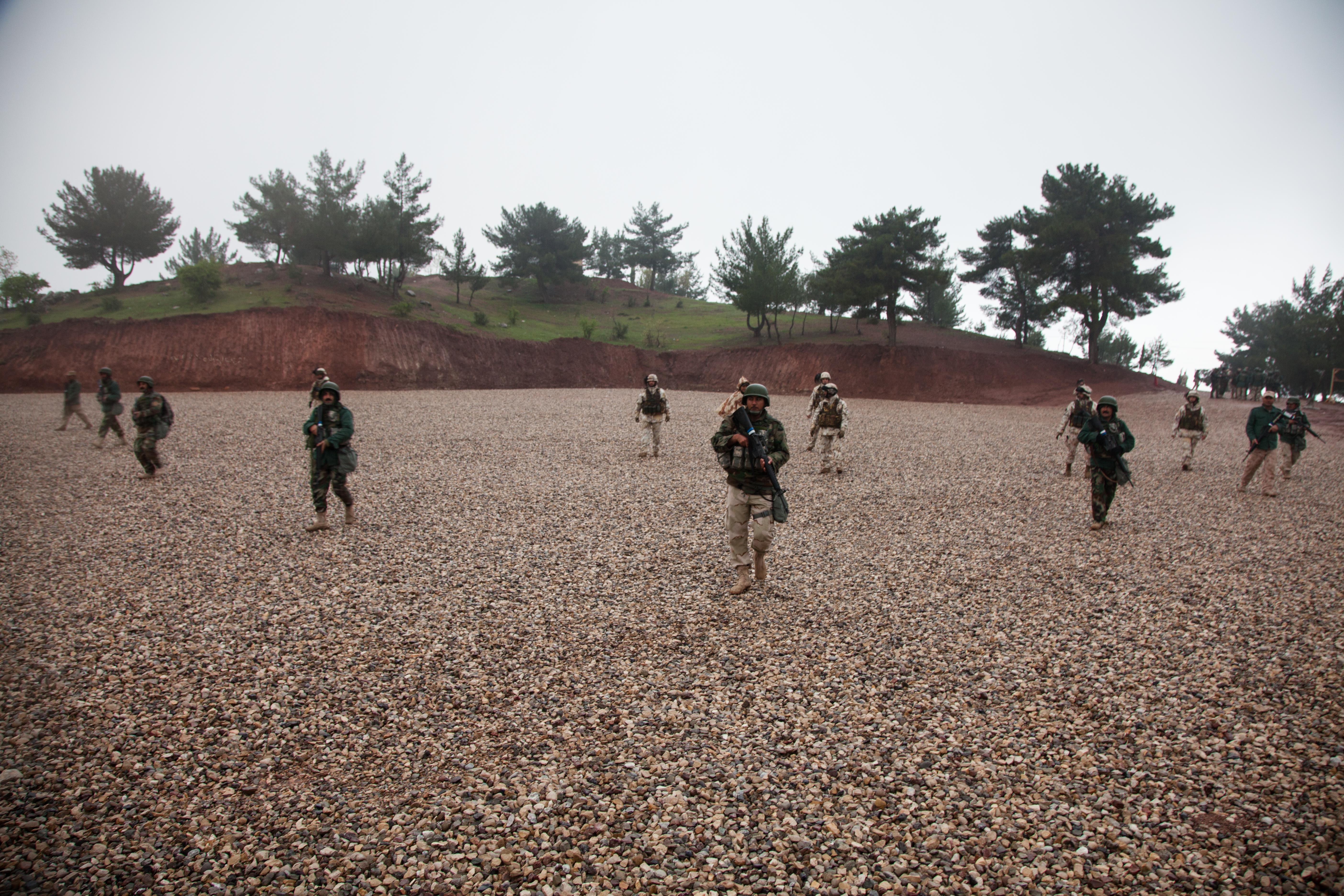 Peshmerga soldiers conduct a live fire exercise under supervision of
