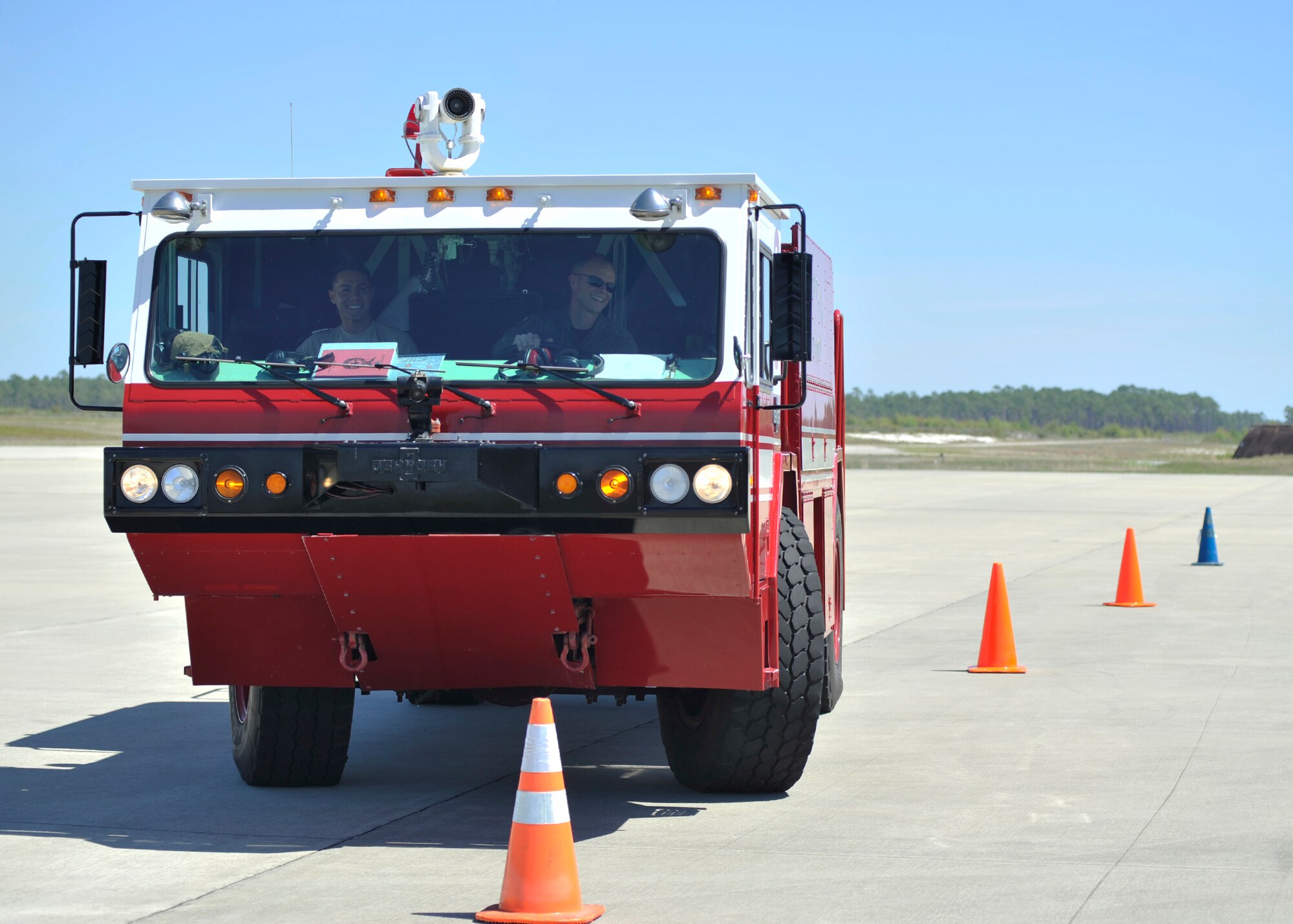 Colonel Derek C. France, 325th Fighter Wing commander, drives a P-19 Crash Truck through an obstacle course April 8 by the Tyndall Air Force Base, Fla., flightline. France was shadowing Staff Sgt. Jacob Banuelos, 325th Civil Engineer Squadron lead firefighter, as part of the Airman Shadow Program. (U.S. Air Force photo by Senior Airman Sergio A. Gamboa/Released)