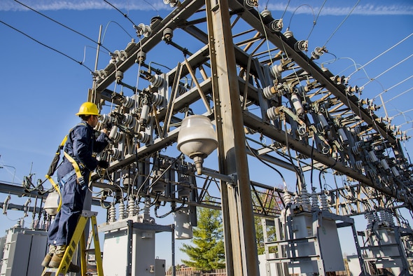 Staff Sgt. Manoj Williams, a 375th Civil Engineering Squadron electrical systems craftsman, greases framework knife blades and tightens loose conductor connections April 9, 2016, at Scott Air Force Base, Ill. The base required a scheduled power outage to repair critical high-voltage electrical components. (U.S. Air Force photo/Airman Daniel Garcia)                                                                    