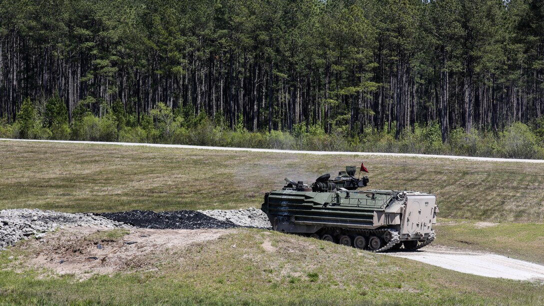 Marines with Alpha Company, 2nd Assault Amphibian Battalion fire on targets with their amphibious assault vehicles during a gunnery skills exercise at Marine Corps Base Camp Lejeune, N.C., April 13, 2016. Marines utilized the AAV’s .50 caliber machine gun and Mk-19 40mm grenade launcher to engage targets at distances between 400 and 2000 meters. 