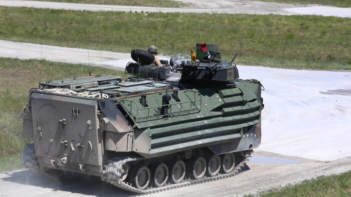 Marines with Alpha Company, 2nd Assault Amphibian Battalion maneuver downrange in an amphibious assault vehicle during a gunnery skills exercise at Marine Corps Base Camp Lejeune, N.C., April 13, 2016. The company conducted the training to prepare for their upcoming participation in the Integrated Training Exercise. 