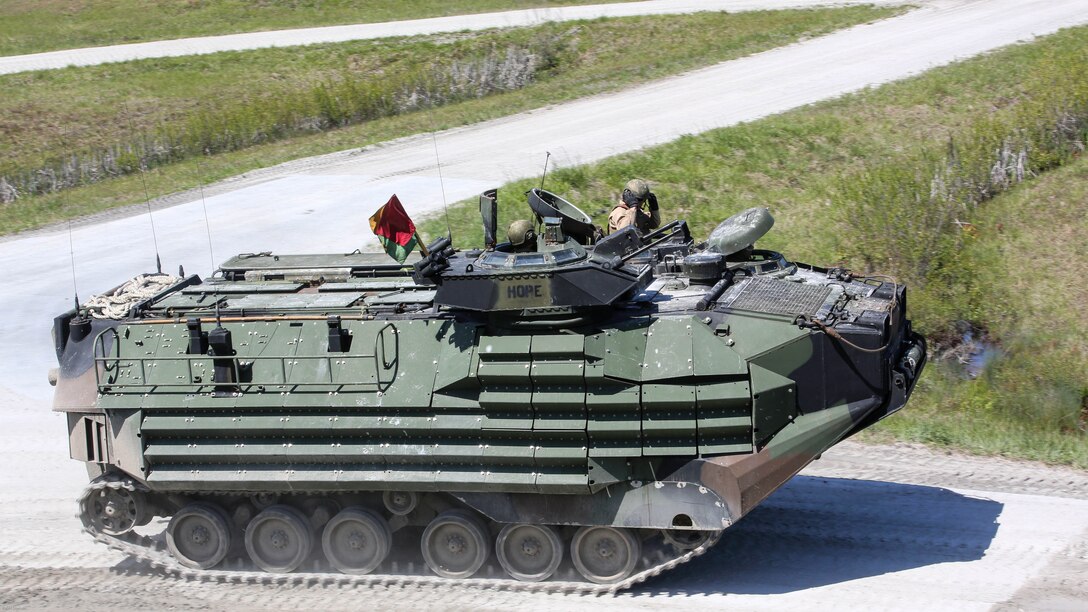 Marines with Alpha Company, 2nd Assault Amphibian Battalion maneuver downrange in an amphibious assault vehicle during a gunnery skills exercise at Marine Corps Base Camp Lejeune, N.C., April 13, 2016. The company conducted the training to prepare for their upcoming participation in the Integrated Training Exercise. 