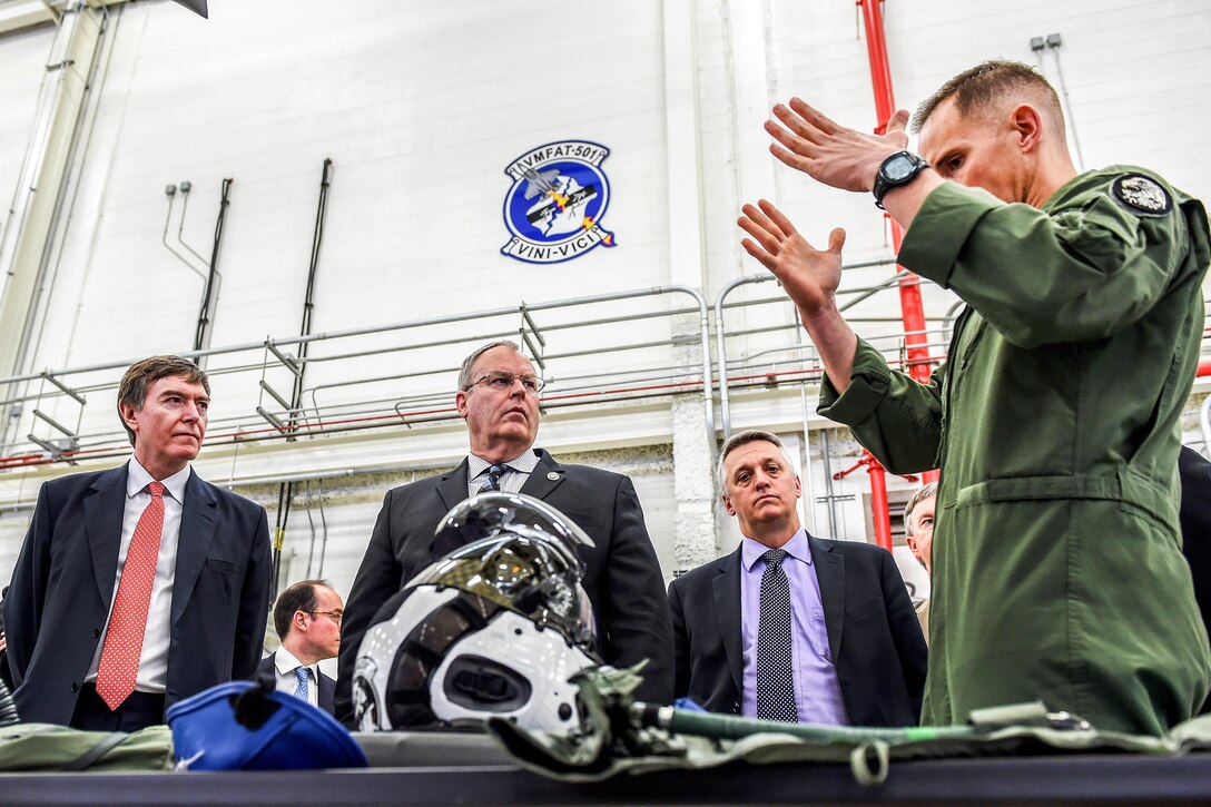 Deputy Defense Secretary Bob Work, center, and British Minister of State for Defense Procurement Philip Dunne, left, receive an equipment capability brief while touring the Marine Fighter Attack Training Squadron 501 facility at Marine Corps Air Station Beaufort, S.C., April 14, 2016. DoD photo by Army Sgt. 1st Class Clydell Kinchen